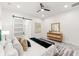 Bright main bedroom with view of the ensuite bath, decorated in neutral tones with black accents at 6054 Heritage Se Way, Mableton, GA 30126