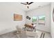 Minimalist home office bathed in natural light, featuring a modern desk and comfortable seating at 6054 Heritage Se Way, Mableton, GA 30126