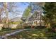 Charming home featuring a backyard with a wooden deck and lush landscaping at 629 Hansell Se St, Atlanta, GA 30312