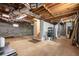 Unfinished basement with concrete walls, utilities, storage area, and potential for customization at 629 Hansell Se St, Atlanta, GA 30312