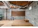 Unfinished basement featuring concrete block walls, utilities, and a platform for flexible usage at 629 Hansell Se St, Atlanta, GA 30312