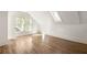 Bright bedroom featuring hardwood floors, multiple windows and skylight for natural light at 629 Hansell Se St, Atlanta, GA 30312
