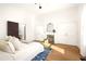 Sunlit bedroom featuring a decorative fireplace and a cozy bed with a blue patterned rug at 629 Hansell Se St, Atlanta, GA 30312