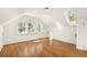 Bright bedroom featuring hardwood floors, multiple windows and skylight for natural light at 629 Hansell Se St, Atlanta, GA 30312