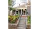 Welcoming entrance to the home with landscaped garden and classic front door at 629 Hansell Se St, Atlanta, GA 30312