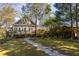 Charming home featuring a backyard with a wooden deck and lush landscaping at 629 Hansell Se St, Atlanta, GA 30312
