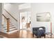 Welcoming foyer with staircase, hardwood floors, and seamless access to an office space at 629 Hansell Se St, Atlanta, GA 30312