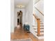 Hallway with wooden floors, staircase, and bench that welcomes you to explore the rest of the home at 629 Hansell Se St, Atlanta, GA 30312