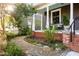 Beautifully landscaped front yard with a stone pathway and inviting porch area at 629 Hansell Se St, Atlanta, GA 30312