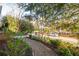 Landscaped front yard featuring a stone walkway leading to the home and trees framing the street view at 629 Hansell Se St, Atlanta, GA 30312
