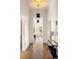 Inviting hallway featuring hardwood floors, contemporary lighting, and elegant decor at 629 Hansell Se St, Atlanta, GA 30312