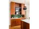 Contemporary kitchen featuring sleek wood cabinets, quartz countertops, and modern lighting at 629 Hansell Se St, Atlanta, GA 30312