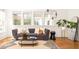 Comfortable living room with modern decor, including a plush sofa, plants, and an oval coffee table at 629 Hansell Se St, Atlanta, GA 30312