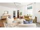 Bright and spacious living room featuring hardwood floors, large windows, and stylish decor at 629 Hansell Se St, Atlanta, GA 30312