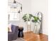 Cozy living room with a unique mirror, lighting fixture, and hardwood floors, perfect for relaxation at 629 Hansell Se St, Atlanta, GA 30312