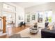 Inviting living room featuring hardwood floors, a stylish rug, and comfortable seating with natural light at 629 Hansell Se St, Atlanta, GA 30312