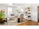 Bright living room with hardwood floors, stylish shelving, decorative fireplace, and designer rug at 629 Hansell Se St, Atlanta, GA 30312