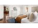 Serene bedroom with a fireplace, large windows, hardwood floors, and stylish decor at 629 Hansell Se St, Atlanta, GA 30312