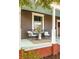 Charming front porch with classic columns, cozy seating, and a colorful ceiling at 629 Hansell Se St, Atlanta, GA 30312