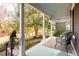 Inviting front porch with ample seating and a lovely view of the landscaped yard at 629 Hansell Se St, Atlanta, GA 30312
