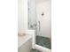 Modern walk-in shower featuring floor-to-ceiling tiles and a frameless glass divider at 629 Hansell Se St, Atlanta, GA 30312