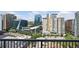 Stunning city view from the balcony showcasing modern buildings and lush greenery at 950 W Peachtree Nw St # 1613, Atlanta, GA 30309