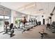 Well-equipped fitness center featuring treadmills, bikes, and natural light through large windows at 950 W Peachtree Nw St # 1613, Atlanta, GA 30309