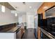 Well-lit kitchen featuring stainless steel appliances, dark backsplash and a large countertop at 950 W Peachtree Nw St # 1613, Atlanta, GA 30309