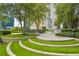Grassy outdoor dining area featuring patio space, a built-in grill, and lush landscaping at 950 W Peachtree Nw St # 1613, Atlanta, GA 30309