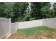 Private backyard with a vinyl fence, offering a safe and secluded outdoor space at 10162 Benton Woods Dr, Covington, GA 30014