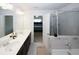 Bathroom featuring double sinks, soaking tub, and separate glass shower at 10162 Benton Woods Dr, Covington, GA 30014