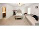 A spacious bedroom featuring two beds and a glimpse into the en-suite bathroom at 10162 Benton Woods Dr, Covington, GA 30014