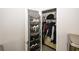 Organized closet with a door-hanging shoe rack and ample hanging space for clothing at 10162 Benton Woods Dr, Covington, GA 30014