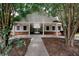 Welcoming community clubhouse with a pathway, featuring a covered entrance and ample natural light at 10162 Benton Woods Dr, Covington, GA 30014