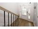Bright entryway featuring hardwood floors, a staircase, and a glass-paneled front door at 10162 Benton Woods Dr, Covington, GA 30014