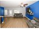 Well-lit living area with modern finishes, including stylish flooring and comfortable furnishings at 10162 Benton Woods Dr, Covington, GA 30014