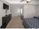 Spacious main bedroom with tray ceiling, ceiling fan, and attached sitting area at 10162 Benton Woods Dr, Covington, GA 30014