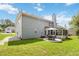 The beautiful home features a spacious backyard with a patio and screened-in porch, perfect for outdoor entertaining at 1127 Oak Hollow Ct, Hampton, GA 30228