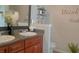 Bathroom with double sink vanity, granite countertop and stylish accents at 1127 Oak Hollow Ct, Hampton, GA 30228