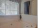Modern bathroom with a white tub and a towel rack with a gray towel at 1127 Oak Hollow Ct, Hampton, GA 30228