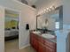 Elegant bathroom with a double vanity, granite countertops, and modern fixtures at 1127 Oak Hollow Ct, Hampton, GA 30228