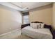 Cozy bedroom with a daybed, neutral walls, and soft natural light at 1127 Oak Hollow Ct, Hampton, GA 30228