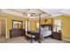 Inviting bedroom with tray ceilings, a ceiling fan, and comfortable decor at 1127 Oak Hollow Ct, Hampton, GA 30228