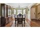 Elegant dining room showcasing a chandelier, bay window, and decorative accents at 1127 Oak Hollow Ct, Hampton, GA 30228