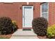 Inviting front door with neat landscaping and a 'No Soliciting' sign at 1127 Oak Hollow Ct, Hampton, GA 30228