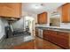 Well-appointed kitchen featuring stainless steel appliances and ample countertop space at 1127 Oak Hollow Ct, Hampton, GA 30228