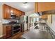 Well-appointed kitchen featuring stainless steel appliances and ample countertop space at 1127 Oak Hollow Ct, Hampton, GA 30228
