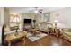 Comfortable living room featuring hardwood floors and classic furnishings at 1127 Oak Hollow Ct, Hampton, GA 30228