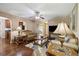 Spacious living room with hardwood floors, neutral walls, and a view to the kitchen at 1127 Oak Hollow Ct, Hampton, GA 30228