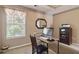 Bright office space featuring a desk, computer, and neutral decor at 1127 Oak Hollow Ct, Hampton, GA 30228
